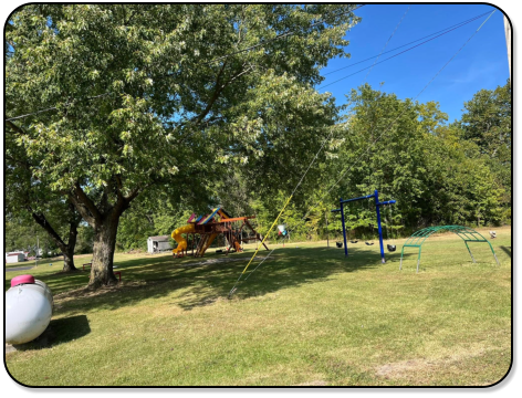 Picnic table and firepit at all RV sites at M & M Outdoors Campground.